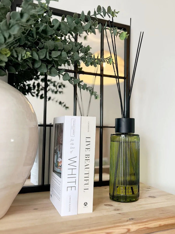 1200ml Green Glass Reed Diffuser - Honeysuckle & Galbanum Scent. Green glass bottle with black reed sticks. 