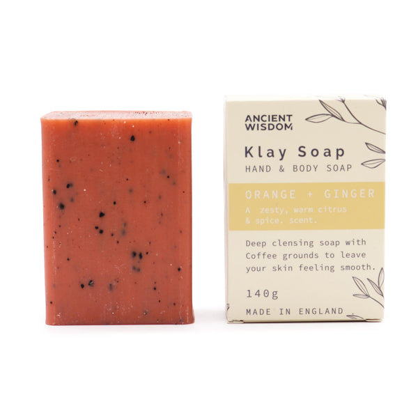 Klay Soap - Orange & Ginger. A rectangular bar of natural, dark-coloured soap with visible cranberry seeds for exfoliation. The soap is infused with Fuller's earth clay and activated charcoal for detoxifying properties.