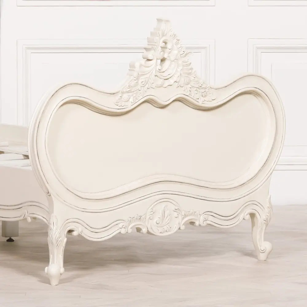 Ornate white Rococo-style headboard on a stylish 3ft single bed for luxury comfort