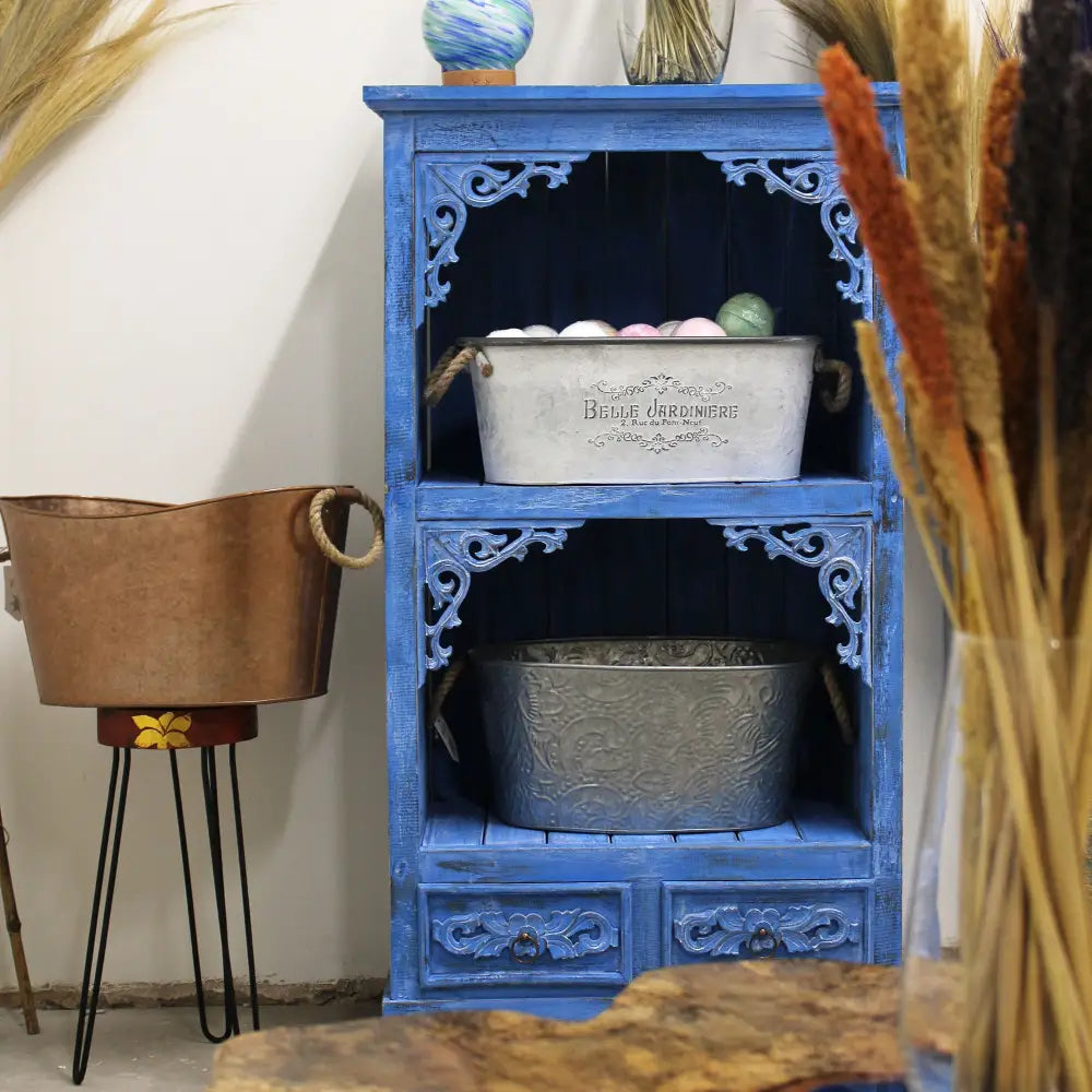 Blue wooden bathroom cabinets made of Albasia wood with ornate details and drawers