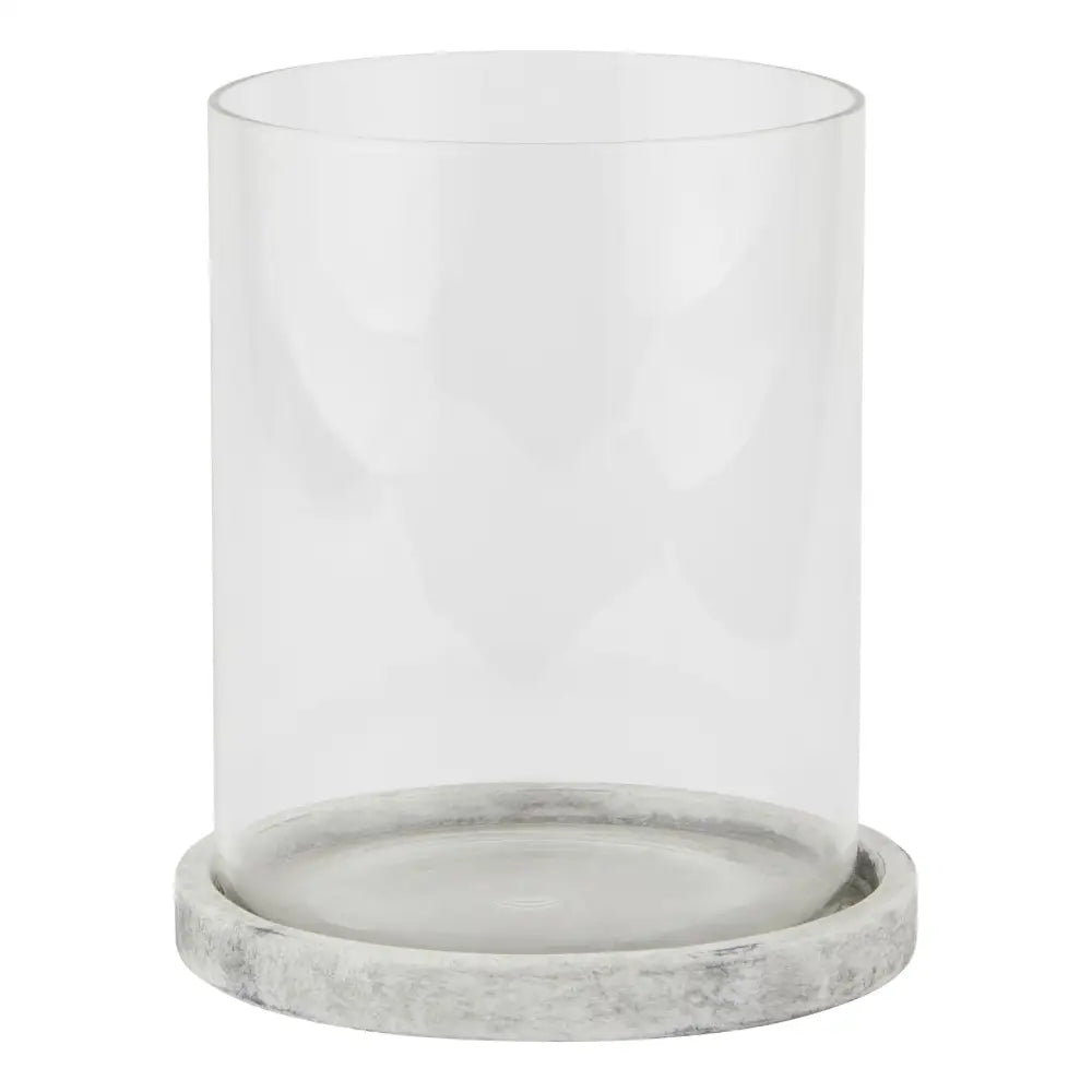 Glass cylinder atop a marble base in the Athena Stone Large Hurricane Lantern