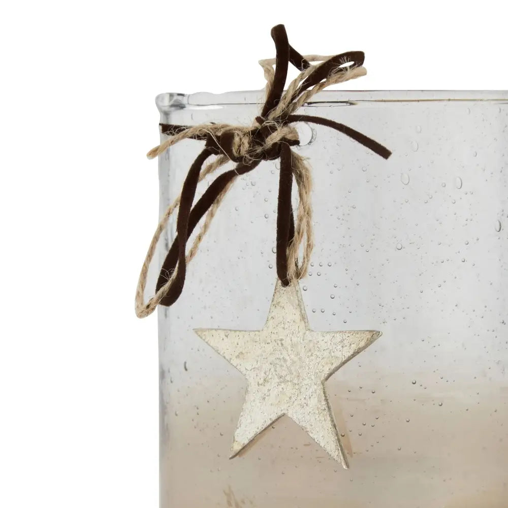 White star-shaped ornament on brown ribbon for Coffee Ombre Collection candle holder