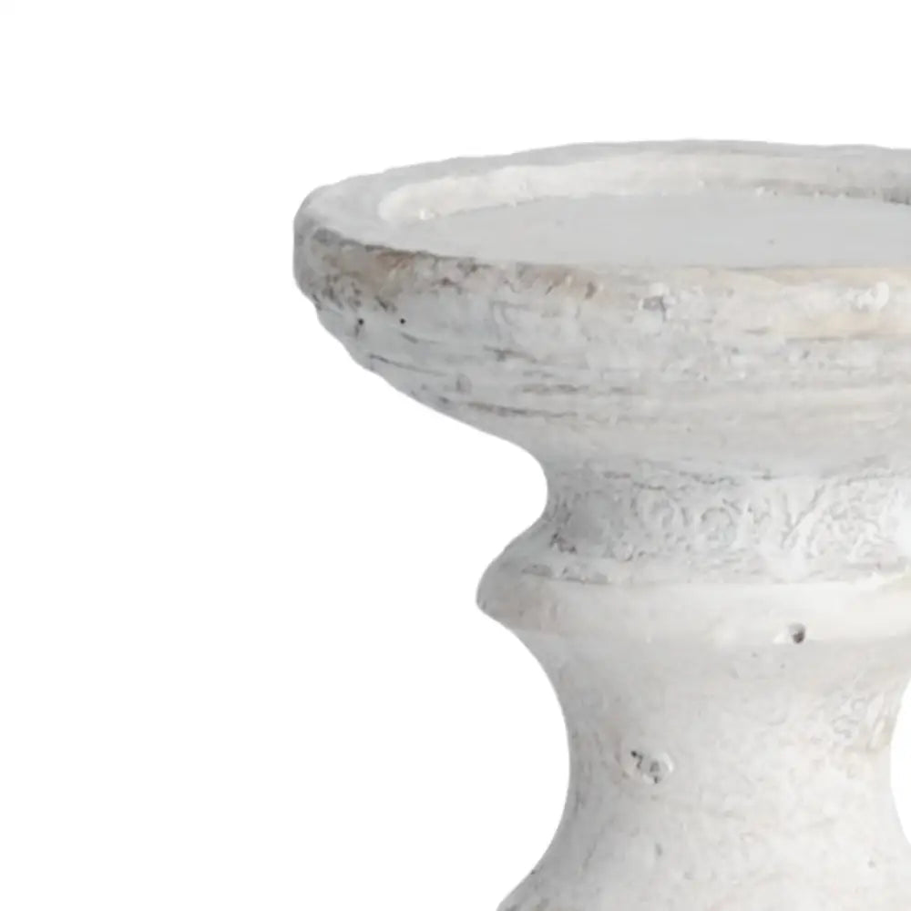 Curved white ceramic candle holder perfect for elegant décor and stylish stone candles