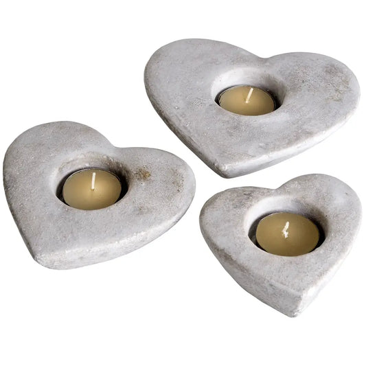 Heart-shaped concrete tea light holders perfect for adding charm to any space