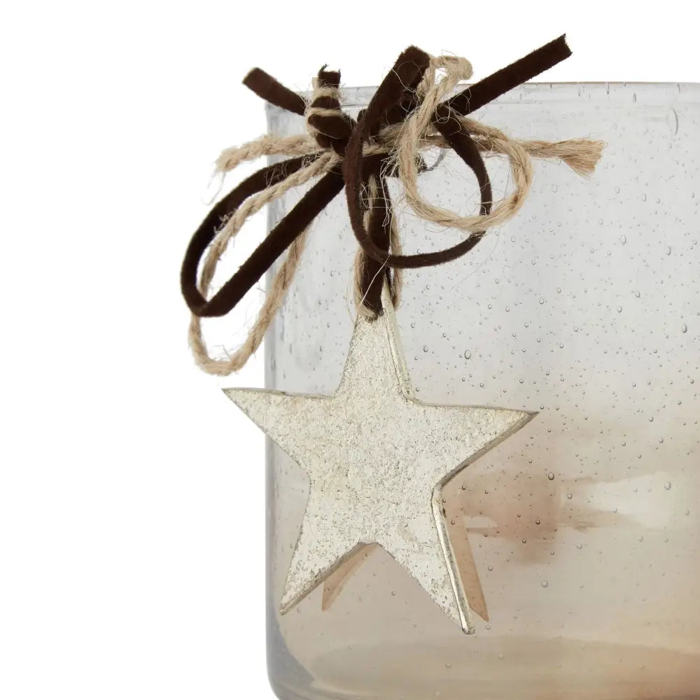 Silver star ornament with ribbon on Shining Star Design Glass Candle Holder for home decor