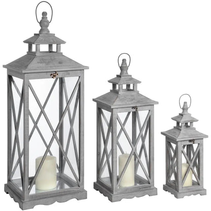 Set of three decorative gray wooden lanterns with candles for cozy home vibes