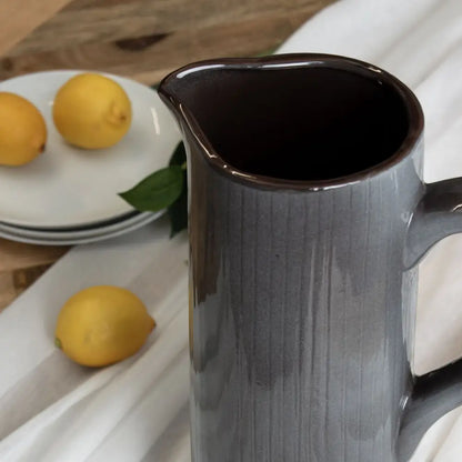 Elegant grey ceramic display jug with a glossy black interior for stylish decor