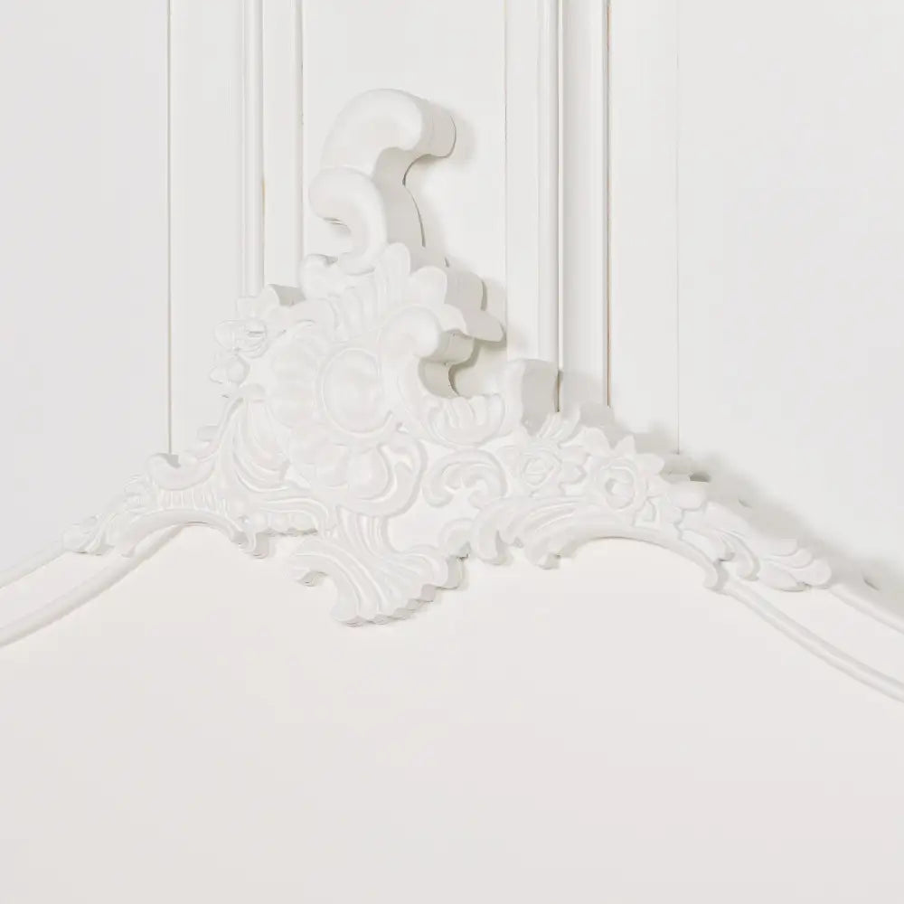 Ornate floral plaster molding on a Hand-Painted Cream 5ft King Size Headboard corner