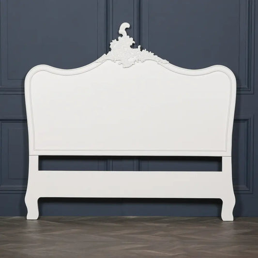 Ornate cream 5ft king size headboard features a curved top and detailed carvings