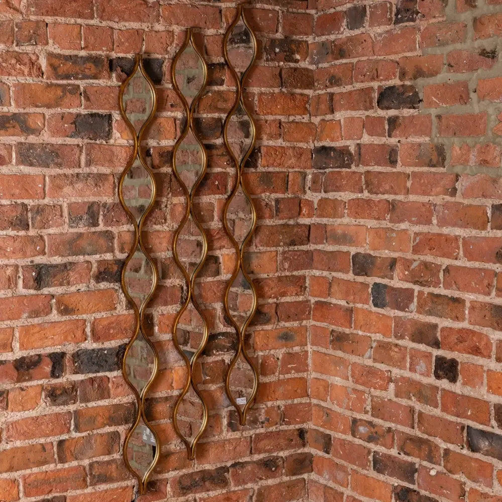 Decorative metal chain-link wall hanging for a chic home mirror with candle diffuser vibes