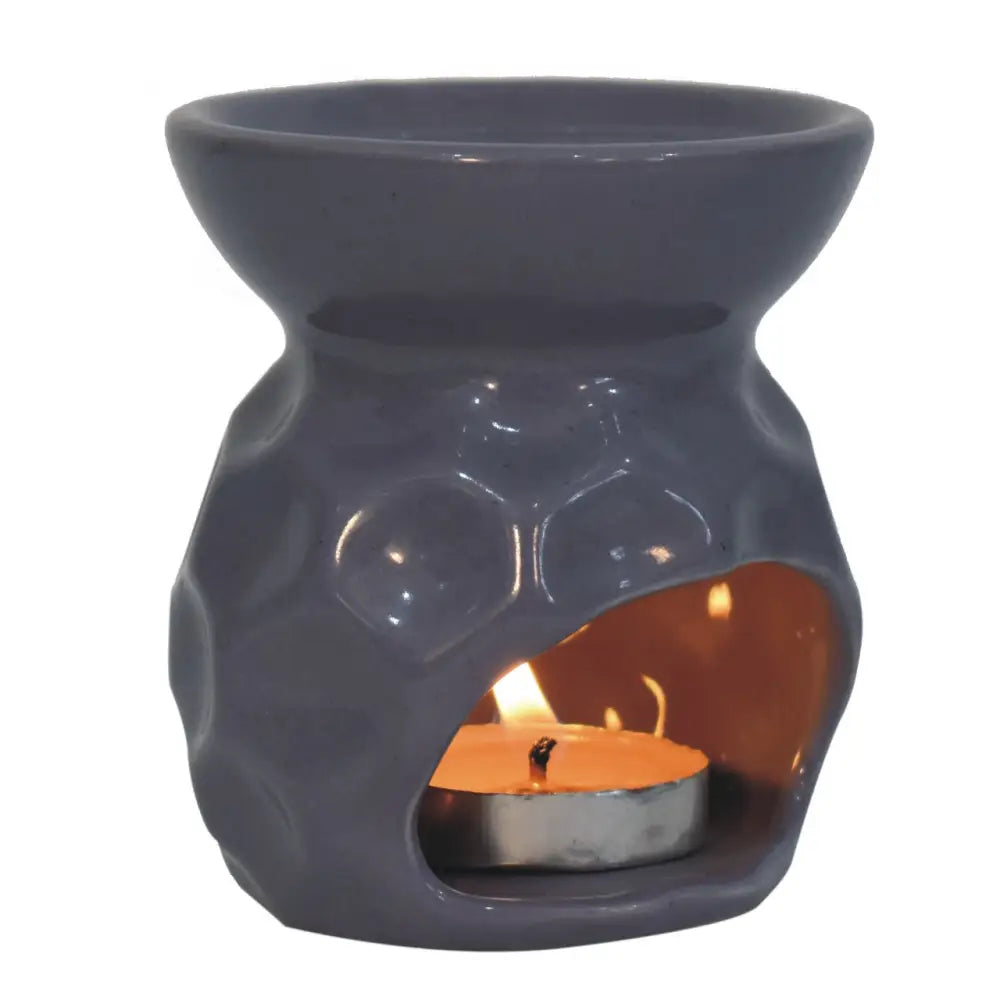 Ceramic Lilac Oil Burner with lit candle in Green Metal Storage Box for Taya Lilac Oil