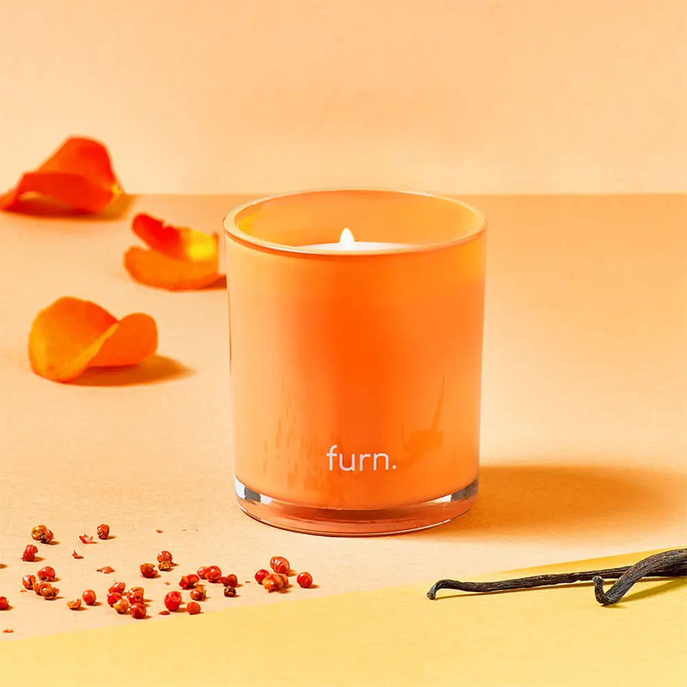 Orange scented candle in a glass container for kindred bergamot and patchouli vibes