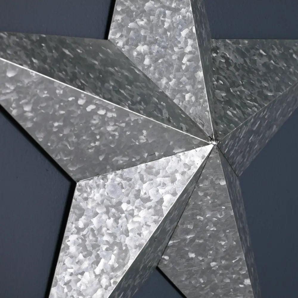 Stunning large metal decorative wall star with a textured, hammered design