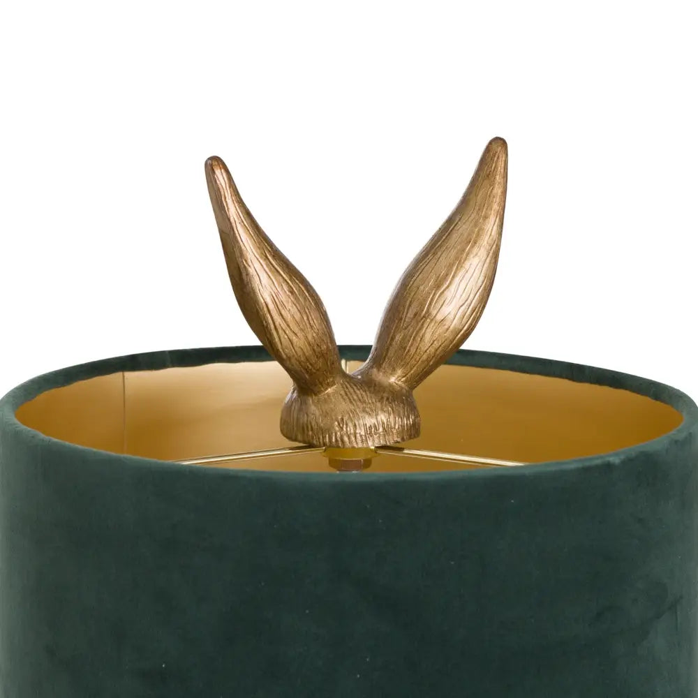 Golden rabbit ears peeking out from a green velvet shade Gold Hare Table Lamp